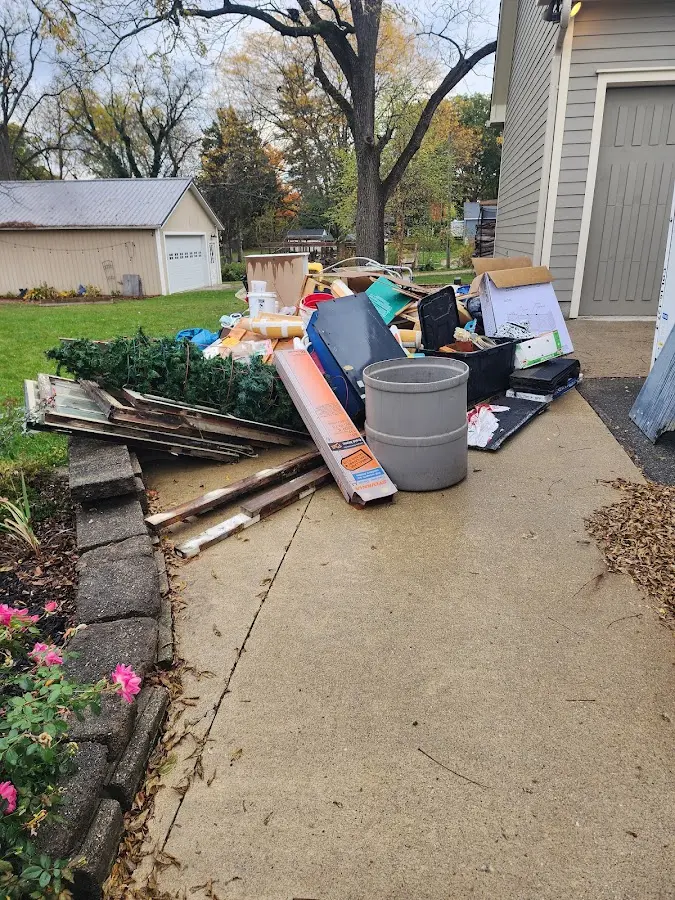 Dumpster being loaded with debris for 12 Yard Dumpster Rental in Tredyffrin